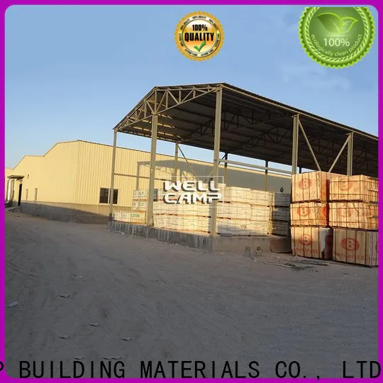 large steel warehouse with brick wall for sale